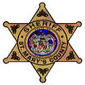 Badge of the St. Marys County Sheriff, featuring intricate details and the text Sheriff St. Marys County.